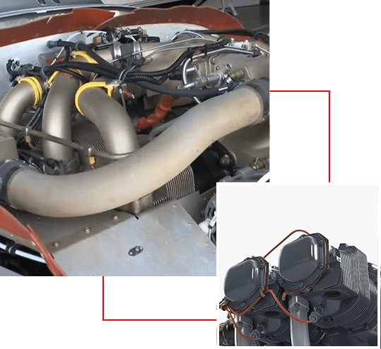 Close-up of a car engine with visible components and hoses.